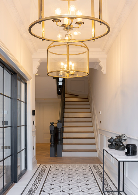 Luxury London townhouse renovation with elegant hallway, patterned tiles and contemporary chandelier lighting