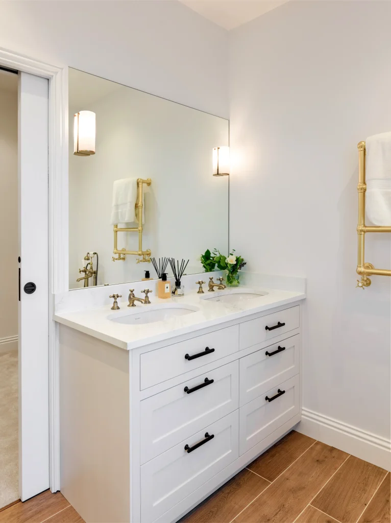 Project London bathroom with vanity unit, brass fittings and mirror design in Fulham Broadway
