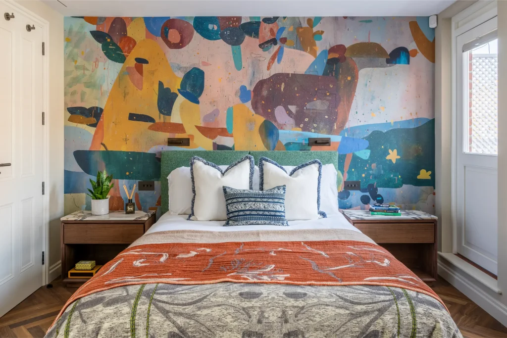Project London bedroom with feature wall mural, bedside tables and contemporary styling in Hurlingham Park