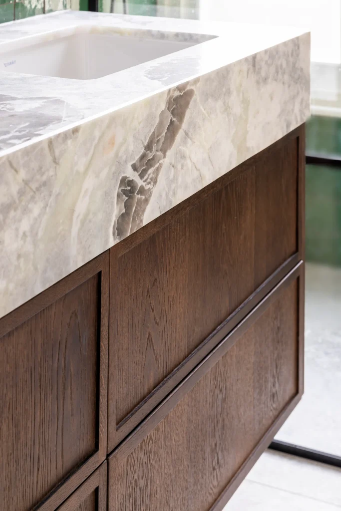 London bathroom vanity in Hurlingham Park with marble worktop and custom wood cabinetry design