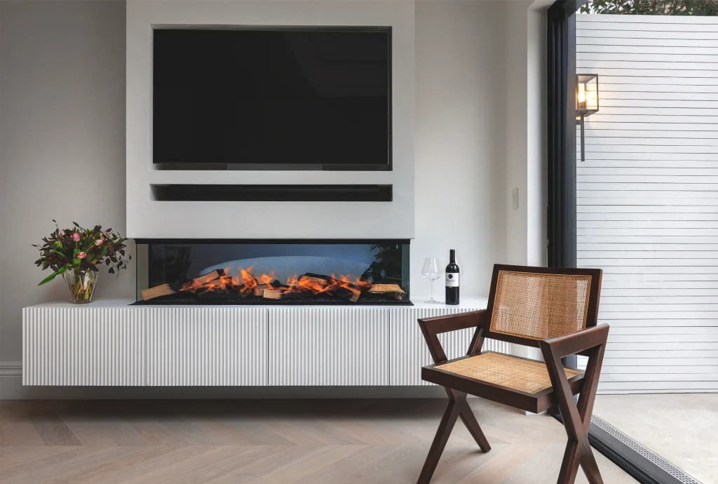 Kensington Place media wall: linear electric fireplace, fluted floating cabinet, and integrated TV