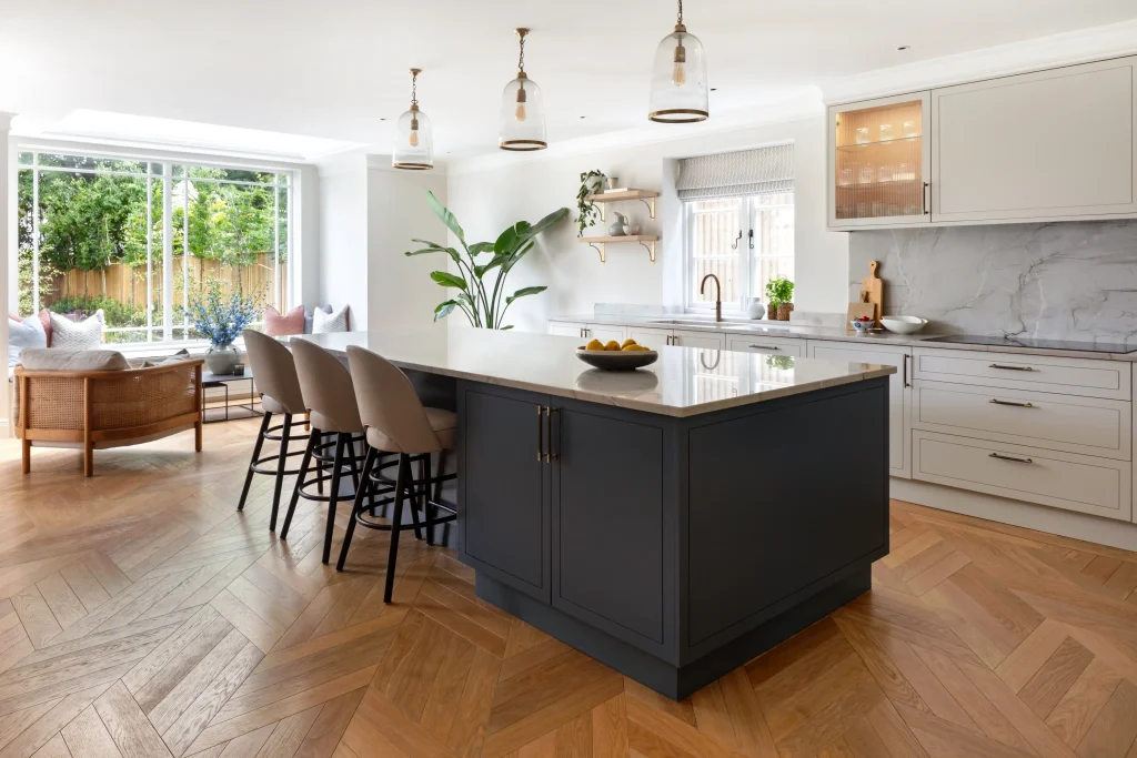 Luxury open plan kitchen in Wimbledon Common London with island seating, pendant lighting and bespoke cabinetry