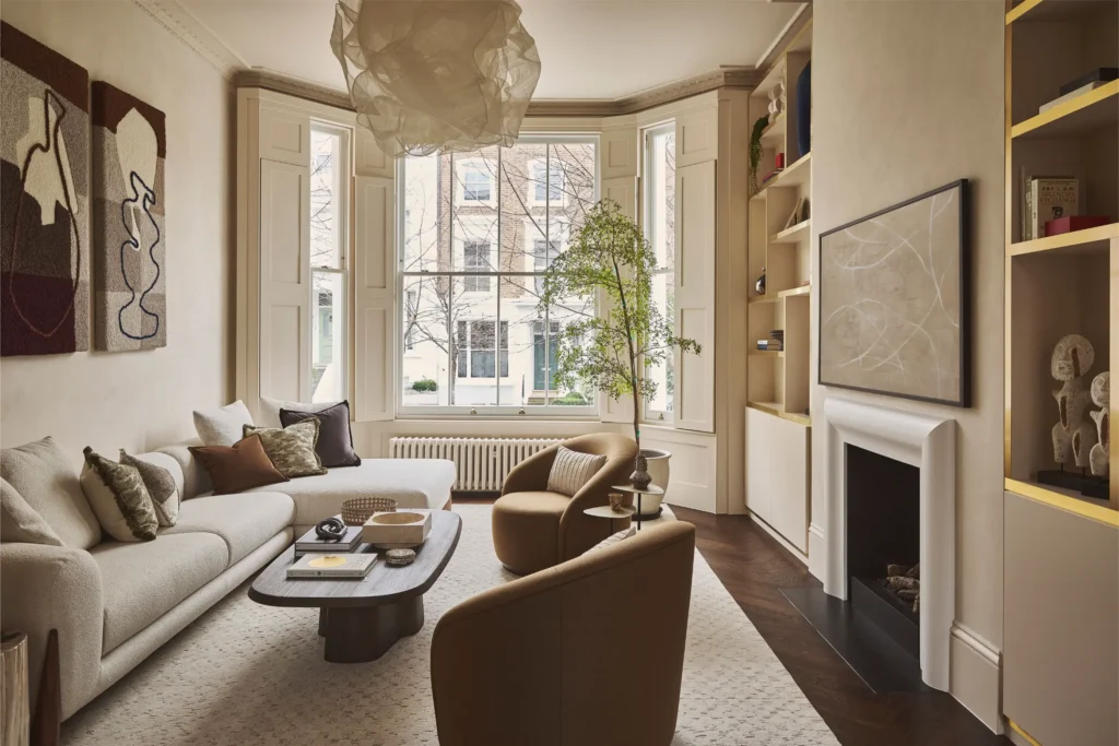 Luxury living room in Portobello Road London with bay window, modern furniture and built-in shelving