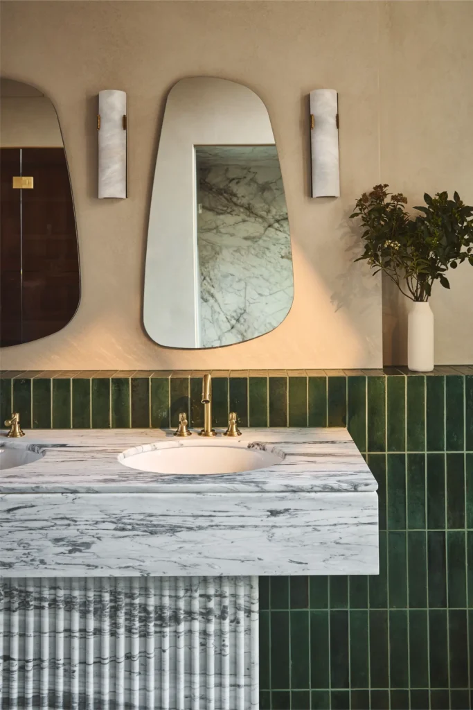 Luxury bathroom interior in Portobello Road London renovation with marble basin and wall mirrors