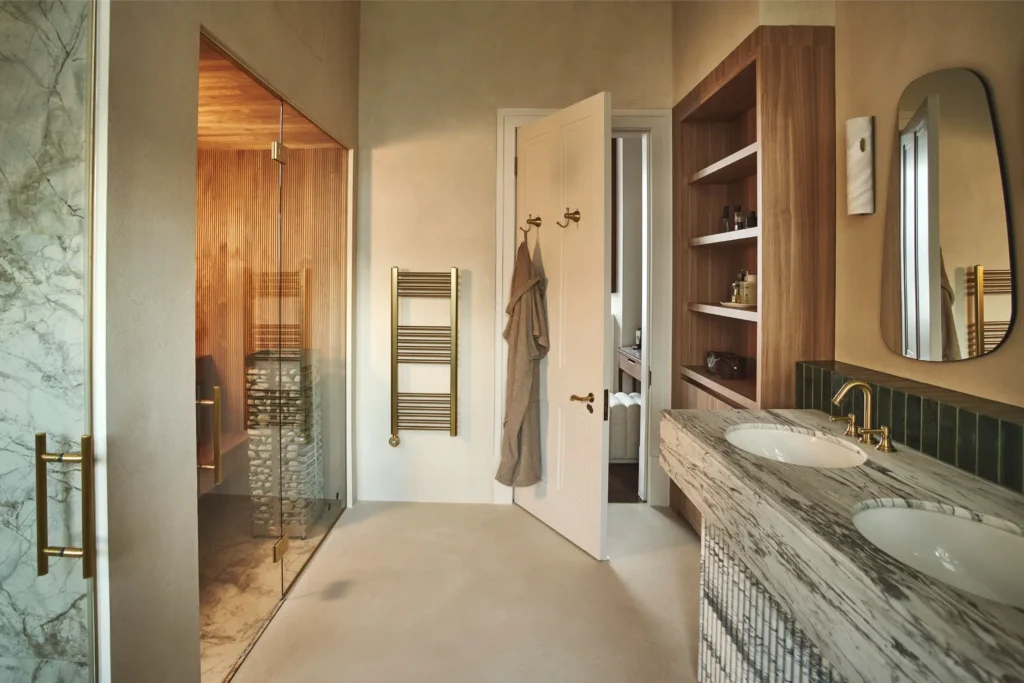 Luxury bathroom renovation in Portobello Road London with marble double sink and built-in wooden storage