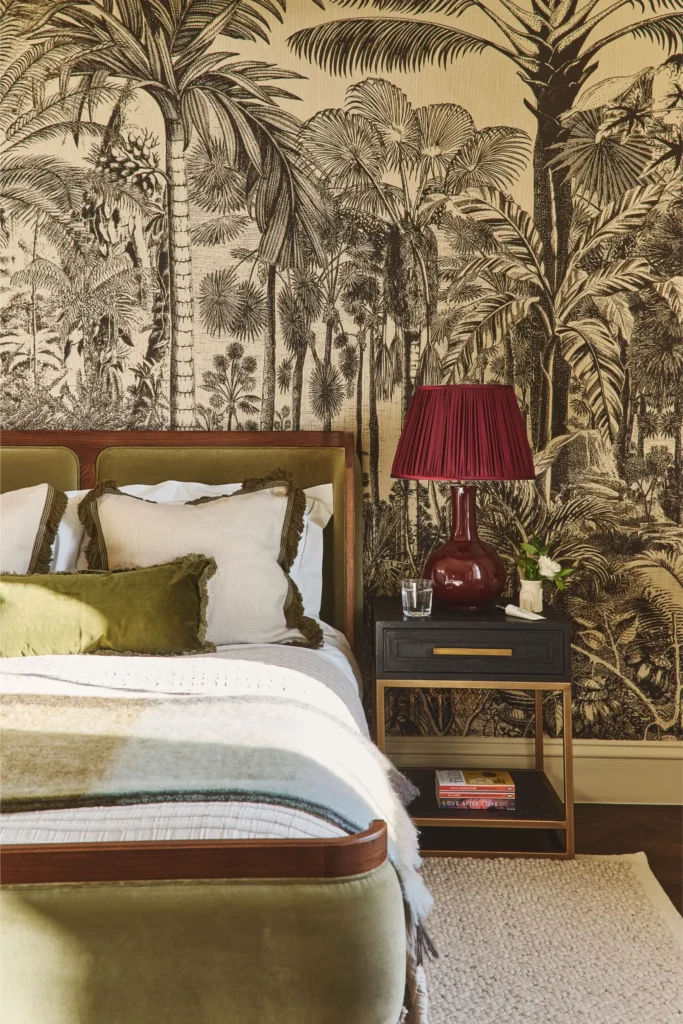 Luxury bedroom interior in Portobello Road London with patterned wallpaper and upholstered bed